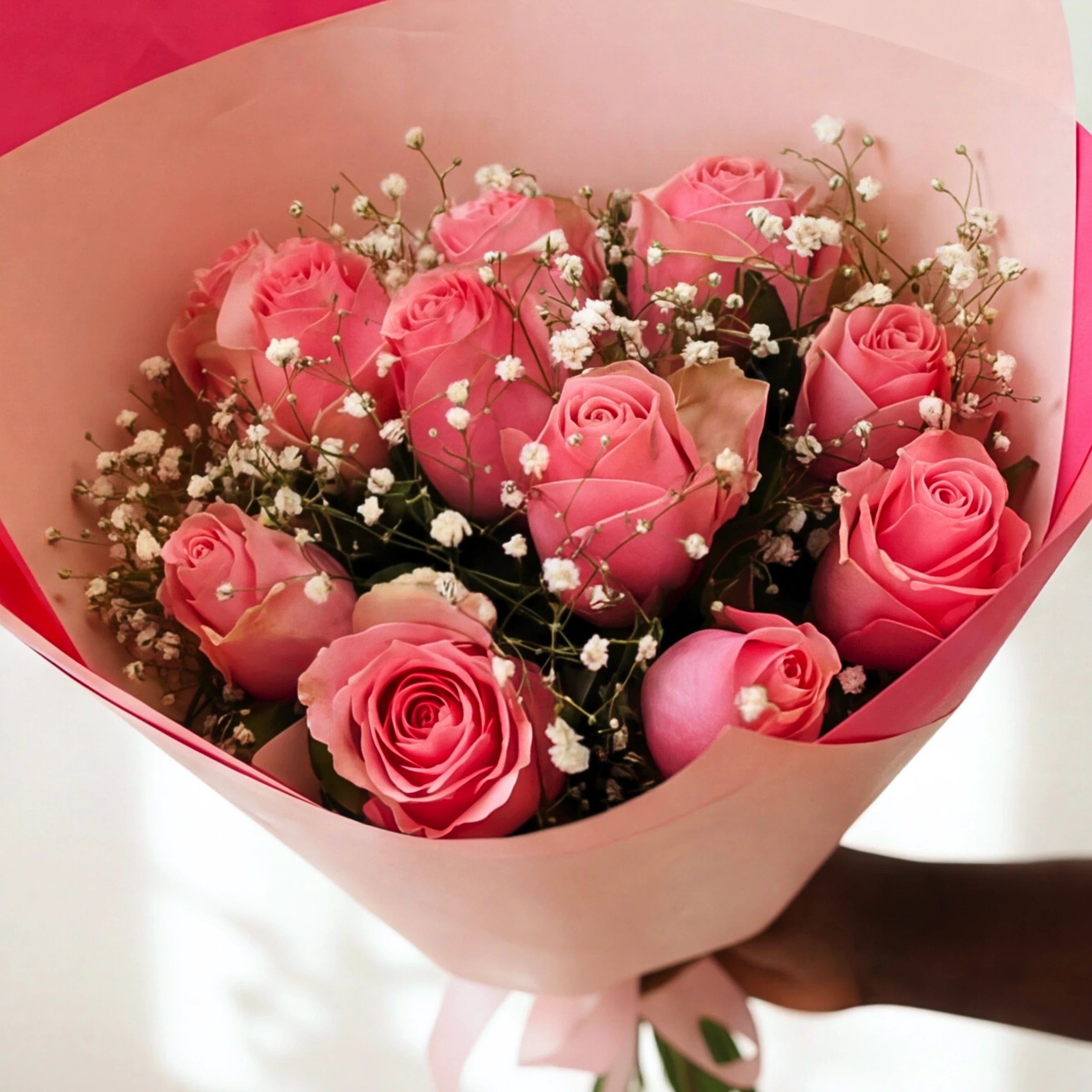 Soft pink roses and white gypsophila gathered in the Sweet Talk bouquet