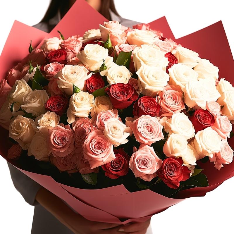 Top view of 500 mixed roses bouquet in shades of red and pink with white roses, wrapped in red