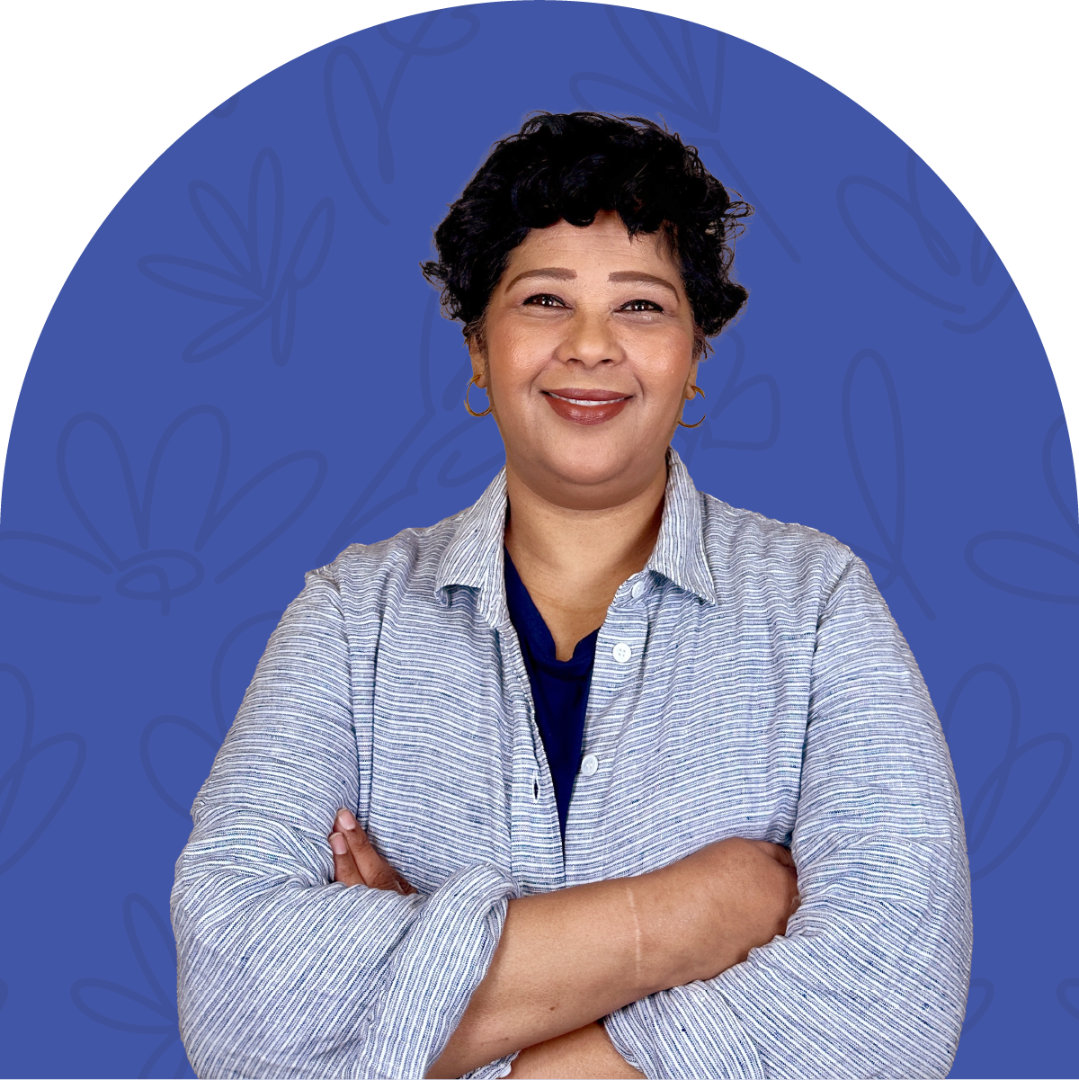 Portrait of Tracey, a long-time team member at Fabulous Flowers for 24 years, with a warm smile and crossed arms. MEET THE TEAM at Fabulous Flowers and Gifts.