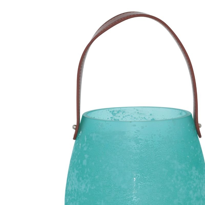 Turquoise lantern with a brown handle on a white background