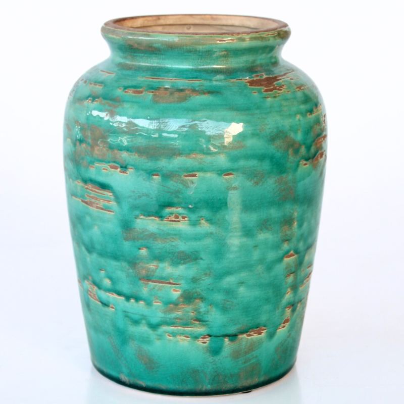 Turquoise ceramic vase with a textured surface on a white background