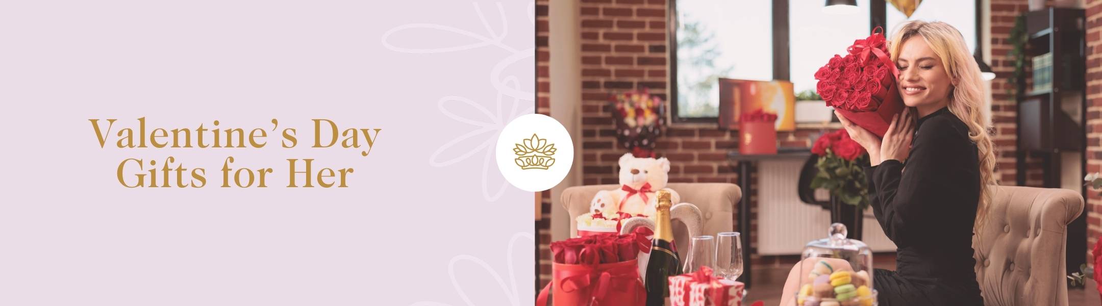 Valentine's Day Gifts for Her by Fabulous Flowers & Gifts, showcasing red roses, champagne, and a teddy bear for a romantic surprise.