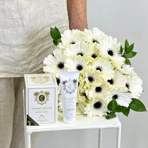 Whispering White Gerbera (20 stems) with Cape Island Candle and Hand Cream - Fabulous Flowers