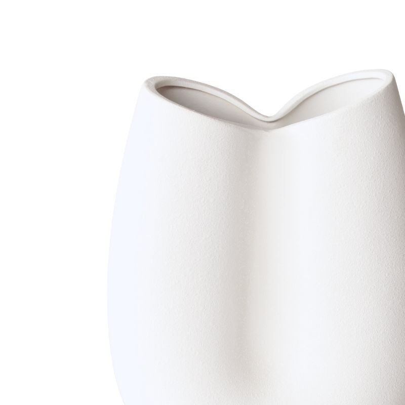 White ceramic pitcher on a white background