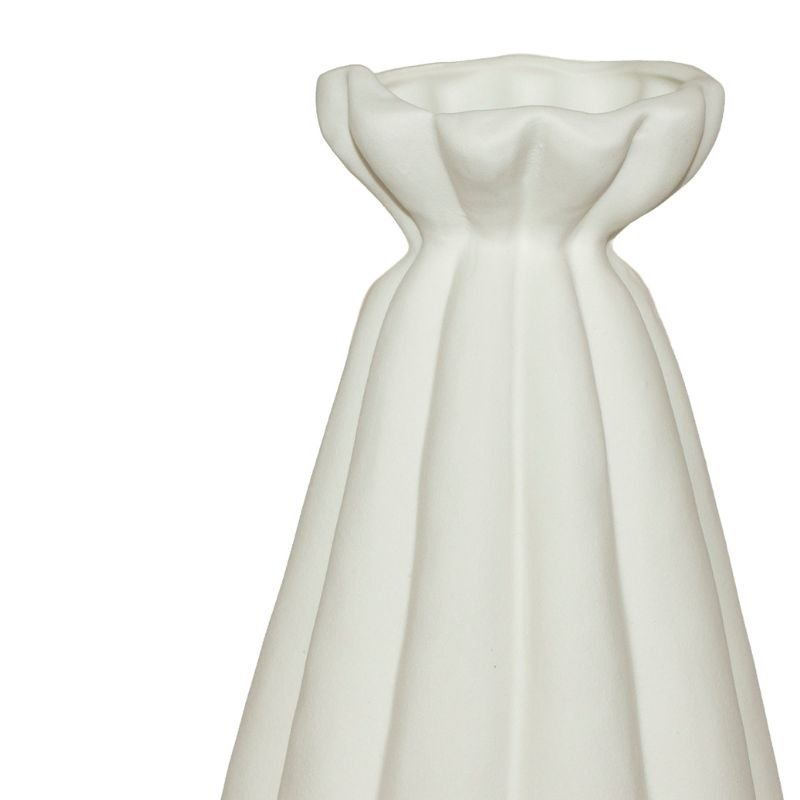 White ceramic dress-shaped vase on a white background