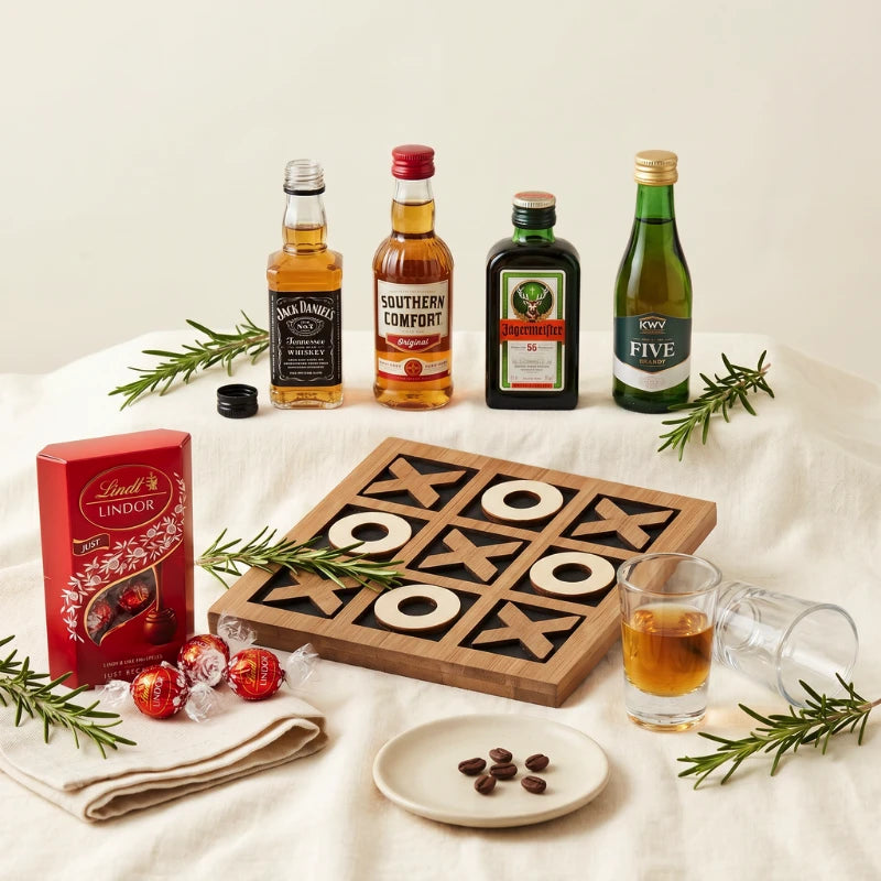 XO Shots styled with Jack Daniel's, Southern Comfort, Jägermeister 56 and KWV Five Brandy spirit miniatures, wooden tic-tac-toe board, shot glasses with whiskey, Lindt Lindor "Just Because" milk chocolate and coffee beans, Fabulous Flowers and Gifts