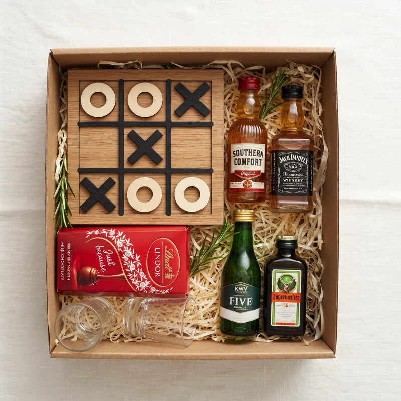 XO Shots gift box top-down with Jack Daniel's, Southern Comfort, KWV Five Brandy and Jägermeister 56 miniatures, wooden noughts-and-crosses board with X and O pieces, two shot glasses and Lindt Lindor "Just Because" milk chocolate, Fabulous Flowers and Gifts