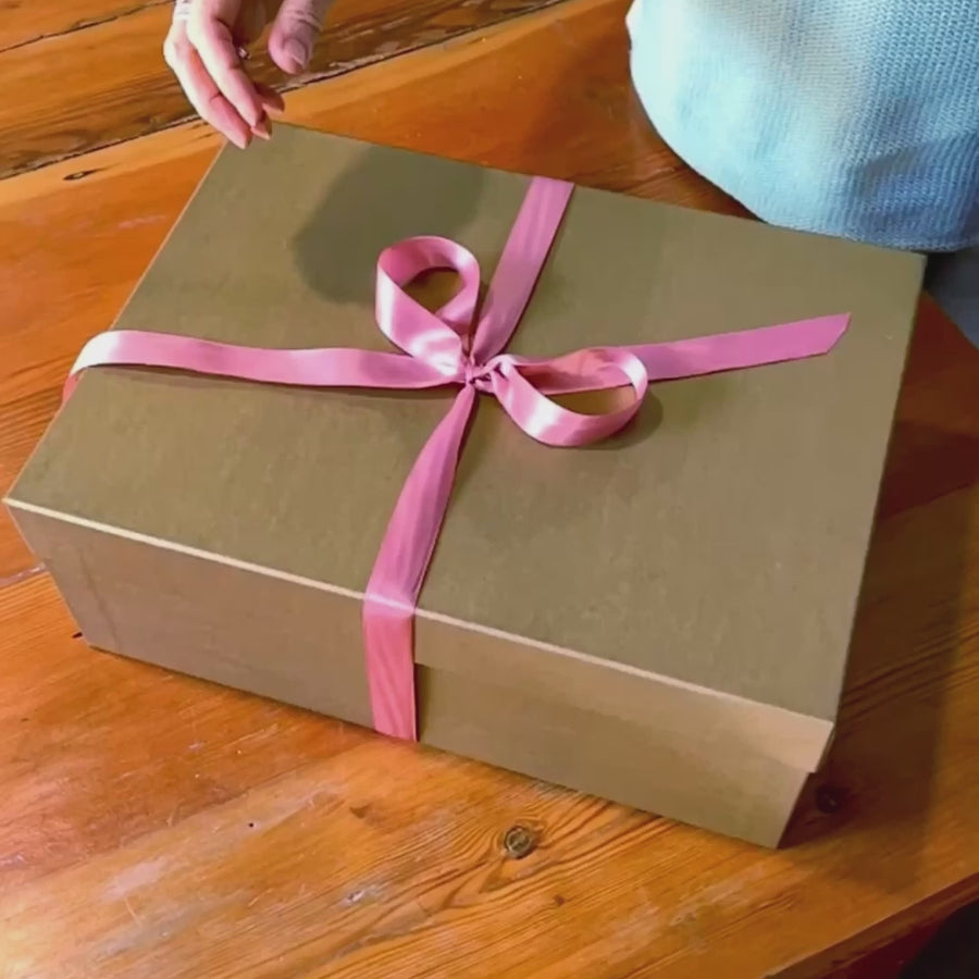 Fabulous Flowers gift box with pink ribbon being opened