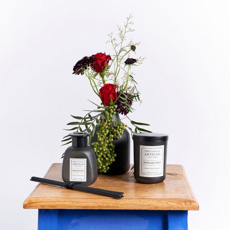 Gorgeous red roses and scabiosas in greenery A trendy black vase The Casual Artisan Woodland Walk candle The Casual Artisan Woodland Walk Diffuser | Fabulous Flowers