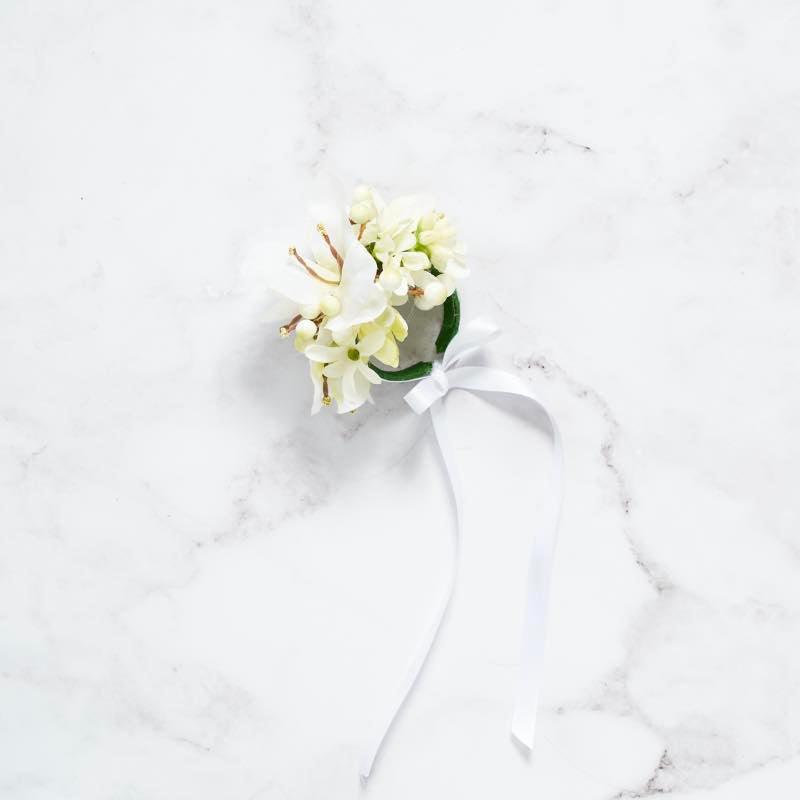 Close up of white corsage with ribbon created with quality silk flowers | Fabulous Flowers Johannesburg