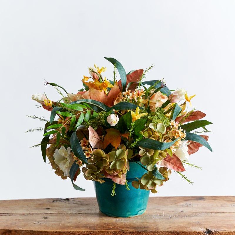 Autumn Silk Blooms artificial flora arrangement in oranges and green and a turquoise blue container | Fabulous Flowers