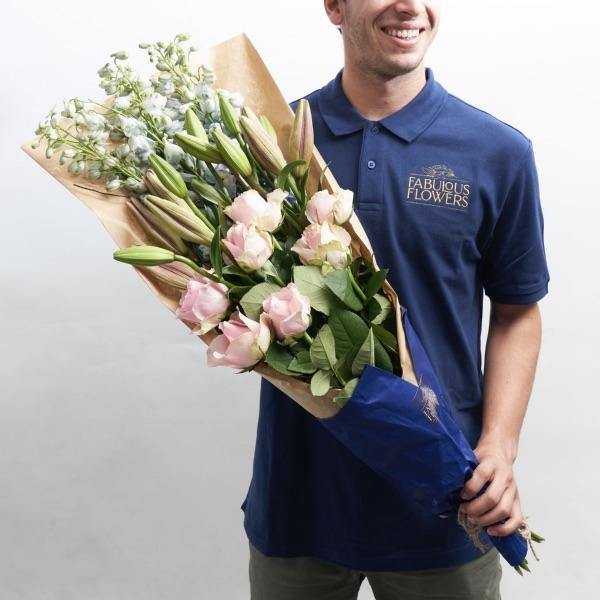 Blushing Beauty Bouquet arranged with light pink roses, lilies and delphinium| Shop Fabulous Flowers