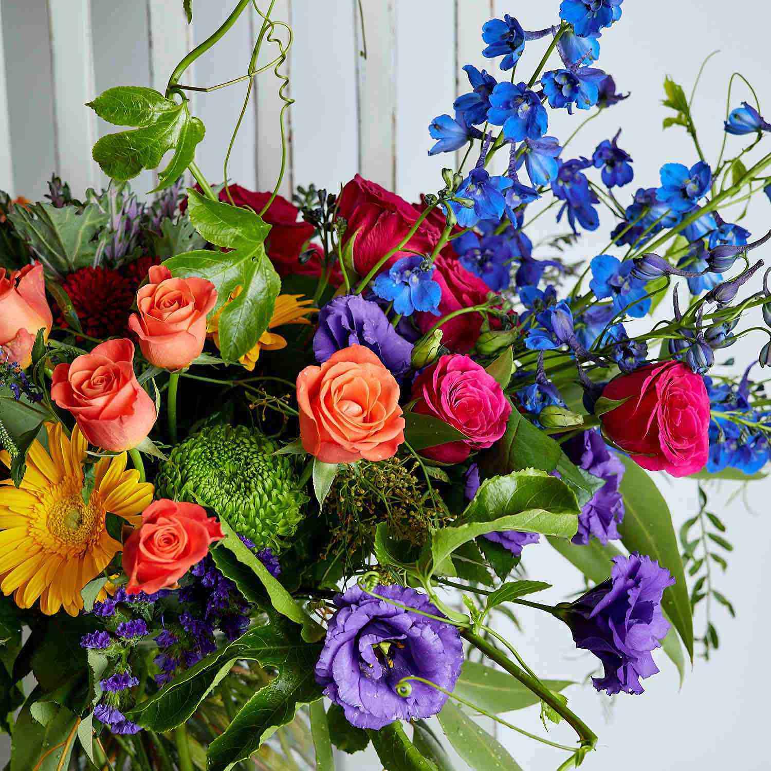 Bright flowers, orange roses, yellow gerberas, blue delphiniums, purple lisianthus - Fabulous Flowers
