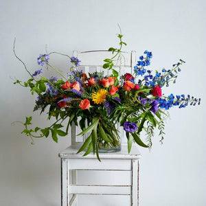 Bright Delight Vase Arrangement filled with bright cut flowers in orange, blue, purple, yellow and cerise and using gorgeous greenery | Shop Fabulous Flowers and gift shop near me