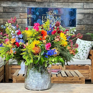 Bright Modern fresh flower arrangement at its finest with vibrant colours and a large glass vase | Fabulous Flowers