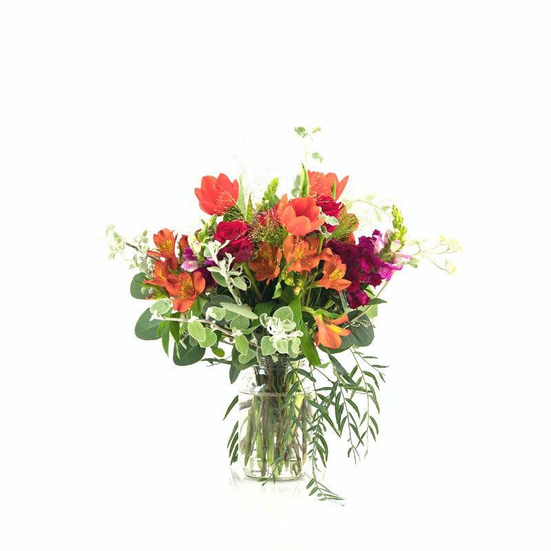 Glass jar arrangement with maroon, red and orange flowers - Fabulous Flowers