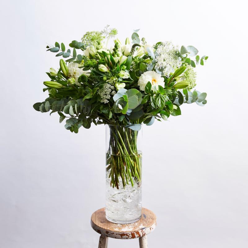 Elegant white roses in glass vase