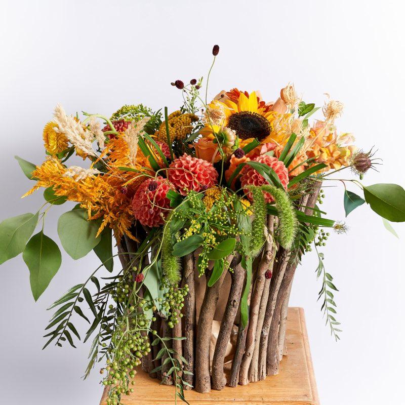 Radiant Sunshine Sunflower Arrangement in Glass Vase within Wooden Basket