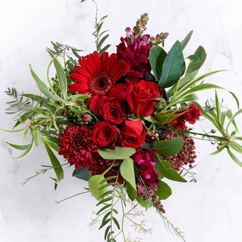 Red rose, gerber, marron snapdragons and  greenery in gold container | Fabulous Flowers