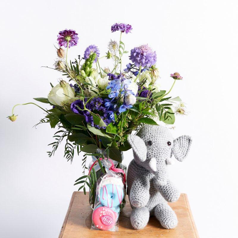 Ellie In The Blooms Kids Gift Set includes:  Blue and white flower arrangement Glass jar Harck & Heart Love Doughnuts Elephant Teddy | Fabulous Flowers