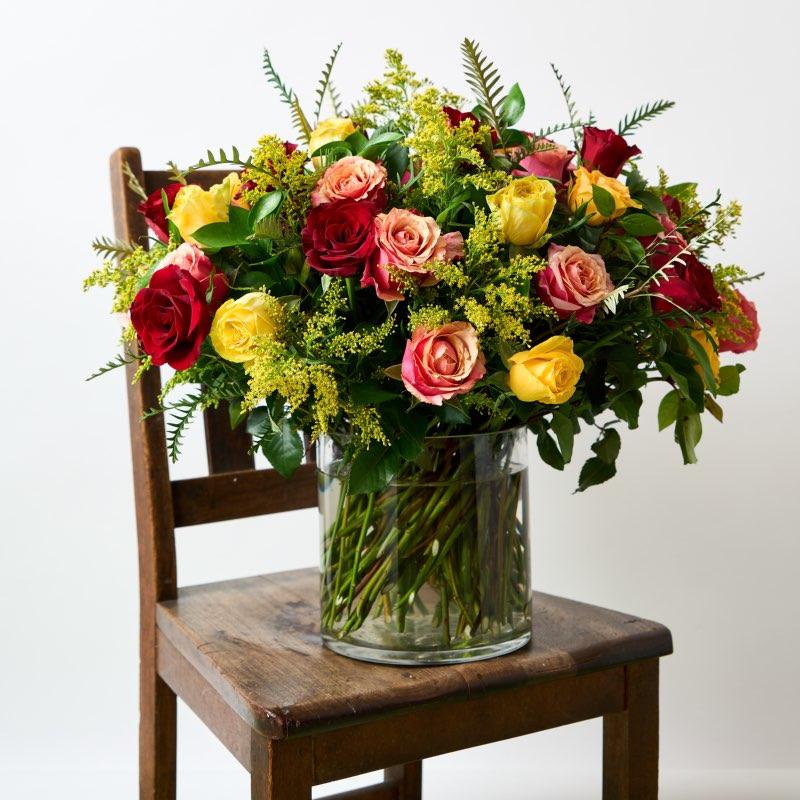 Golden Sunrise moments with this fresh red, orange and yellow rose arrangement for same day flower delivery from Fabulous Flowers and Gifts
