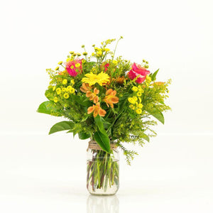 Orange and yellow flowers arranged in a glass jar and delivered to your favourite Cape Town people by Fabulous Flowers