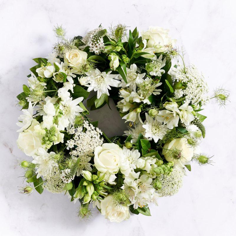 White wreath arrangement with roses, lace, snapdragons and sprays | Fabulous flowers SA Florist