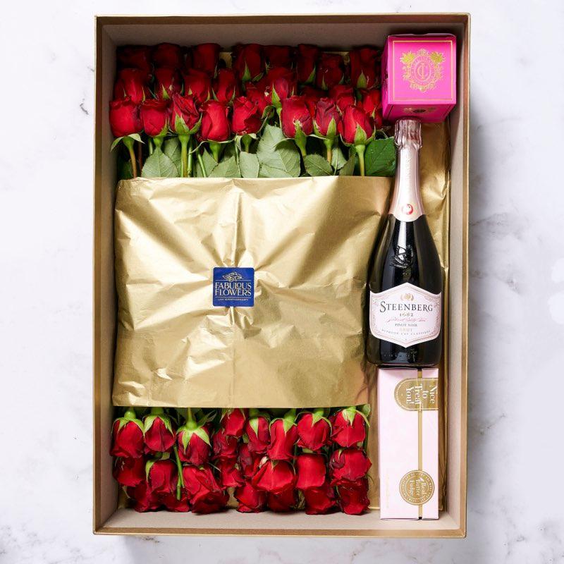 50 red roses, Steenberg Pinot Noir Cap Classique, Cape Island candle, Frank & Olive fudge gift box | Fabulous Flowers