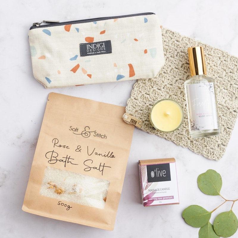 It's Me Time pamper box includes:   Salt & Stitch bath salts Bibi knitted face wipe O'live soy massage candle Terreza print bag Firefly room spray from Fabulous Flowers and Gifts