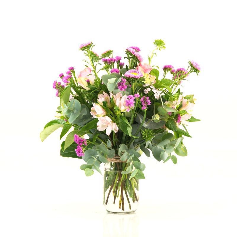 Pink flowers arranged in a glass jar with penny gum (eucalyptus), statice, roses and asters for same day delivery in Cape Town