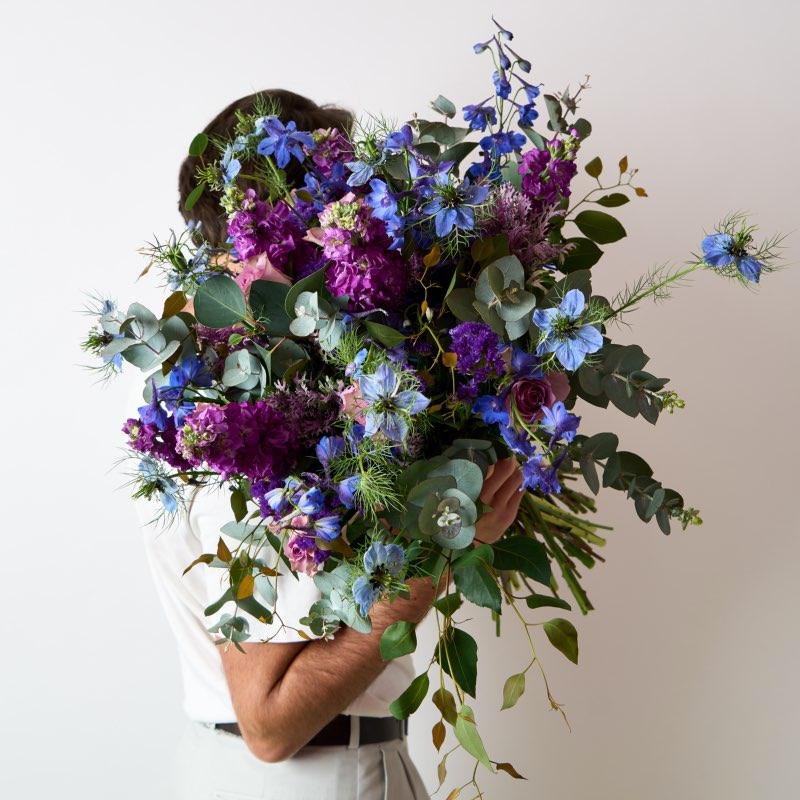 The Lavender Garden Bouquet of flowers is a beautiful bunch arranged with delphinium, stocks, pennygum and other exquisite blooms for Same Day Delivery Cape Town