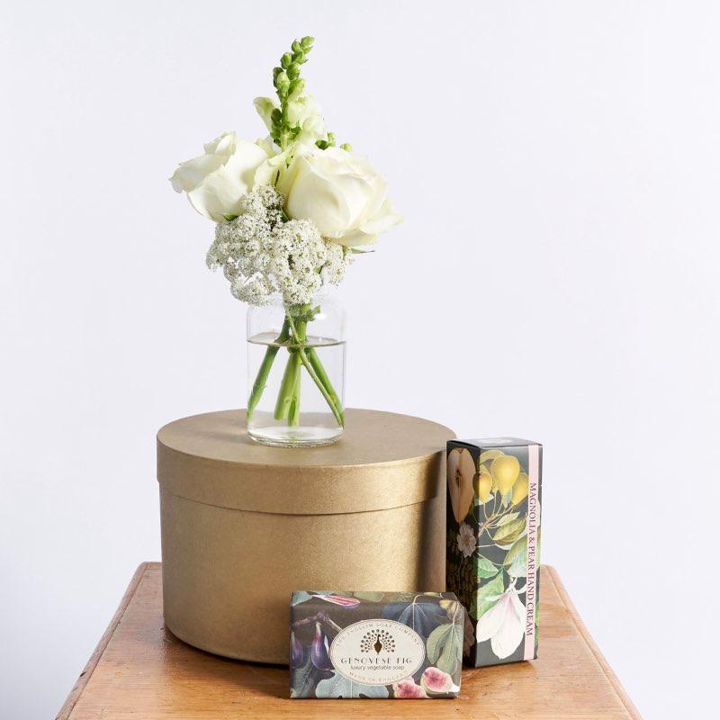 Gorgeous flower arrangement including white roses, lace and snapdragons  Magnolia & Pear hand cream The English Soap Company Genovese Fig soap bar | Fabulous Flowers