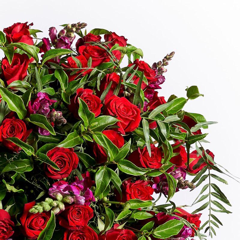 36 red roses with snapdragons wrapped a s a beautiful romantic bouquet of flowers | Fabulous Flowers