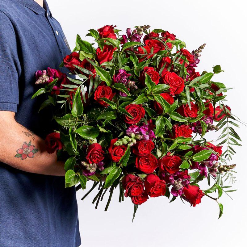 36 red roses with snapdragons wrapped a s a beautiful romantic bouquet of flowers | Fabulous Flowers