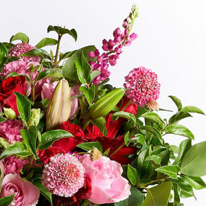 Close up of romantic bouquet with lilies, pink roses and pink lisianthus | Fabulous Flowers