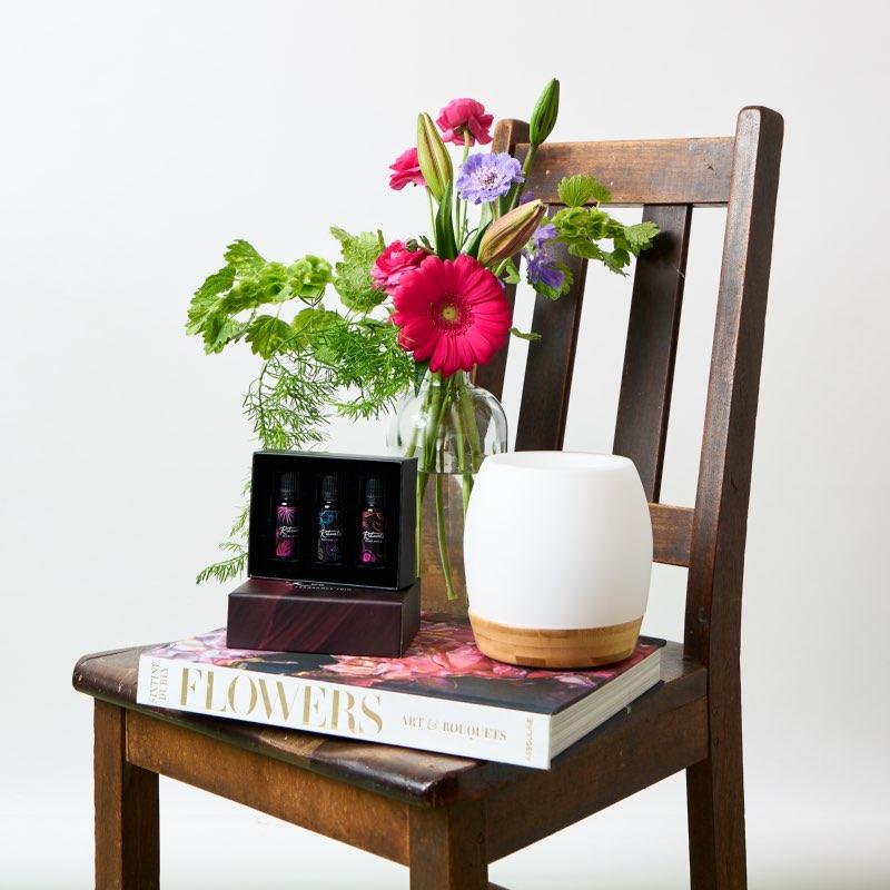 Zen Floral Diffuser Gift with Aura diffuser, a trio of fragrance and a glass vase arrangement with colourful stems of flowers makes the perfect gift for fragrance loving friends delivered same day delivery by Fabulous Flowers and Gifts.
