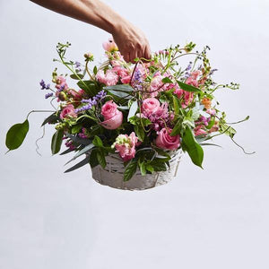 Pink flowers in Country Flowers Wooden Basket arrangement