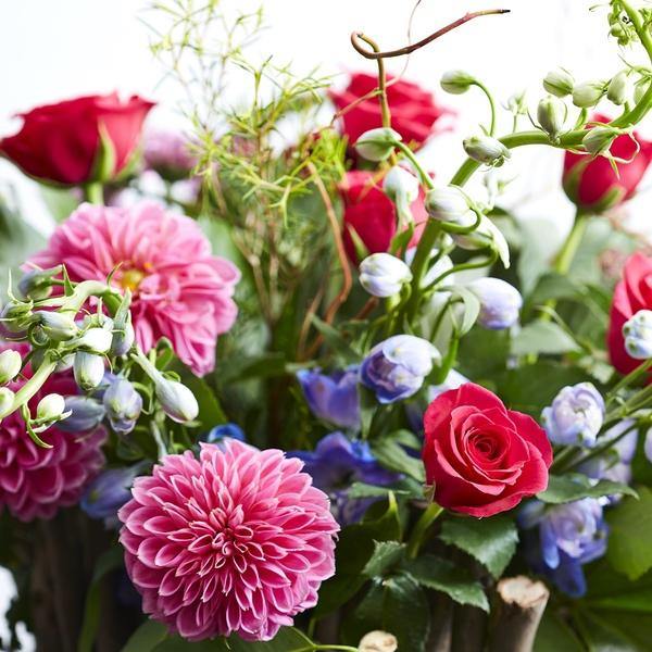Floral Art Echoing Gucci Fragrance with pink dahlias and blue delphinium