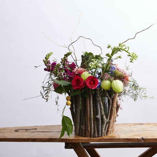 Colourful Abundant Flower Arrangement with red roses, maroon snapdragons and more