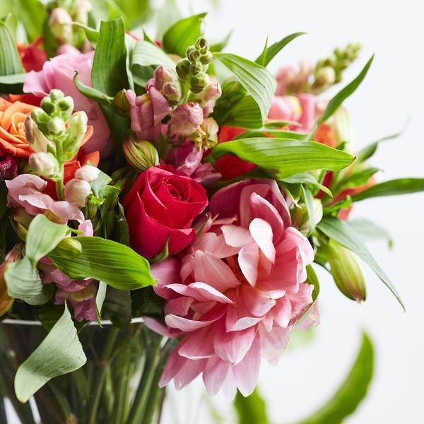 Dahlia and Snapdragon flowers accompanying pink and orange roses